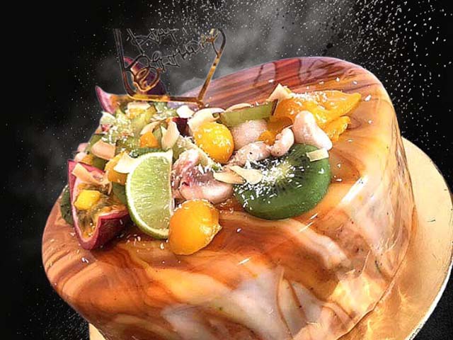 entremets à la mangue passion , avec une namelaka au chocolat au lait Jivara trés gourmand, le tout posé sur un biscuit financier aux amandes